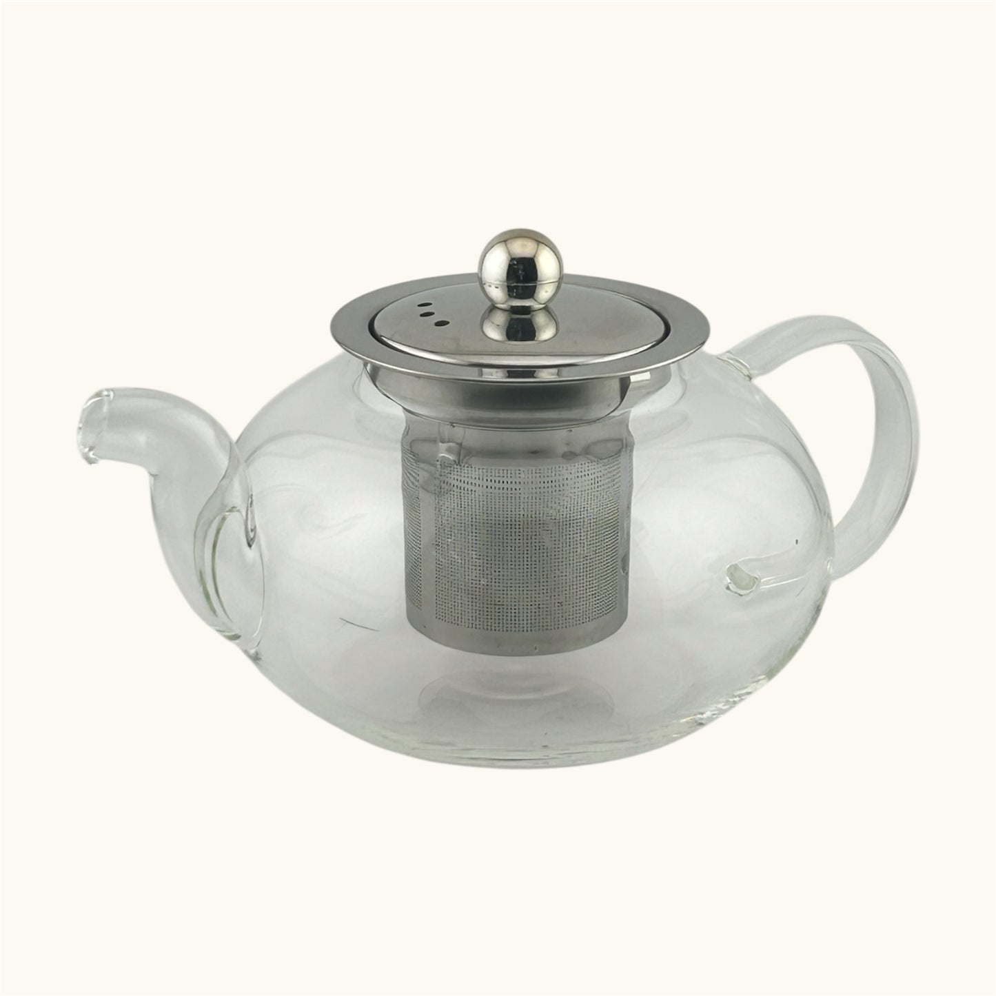 غوري شاي زجاجي شفاف مقاوم للحرارة بسعة 0.6 لتر، مزود بشخال معدني من الستانلس ستيل وغطاء أنيق بلمسة معدنية. مثالي لتحضير الشاي بسهولة وتصفية الأوراق بكفاءة.